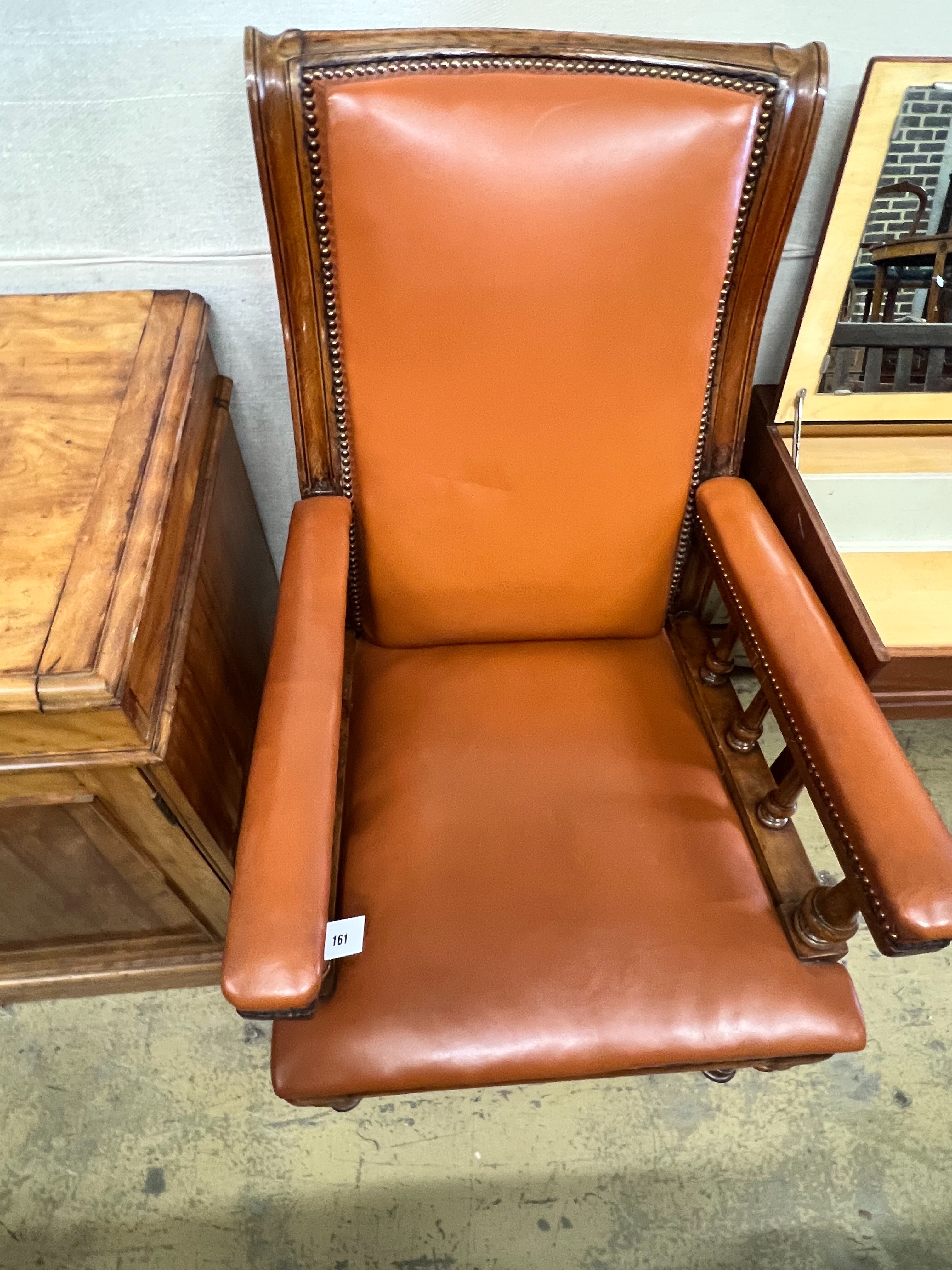 A late Victorian oak and leather library armchair, width 62cm depth 76cm height 110cm